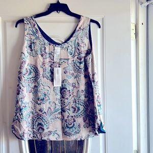 a multi colored reversible camisole never worn size 2 100% polyester